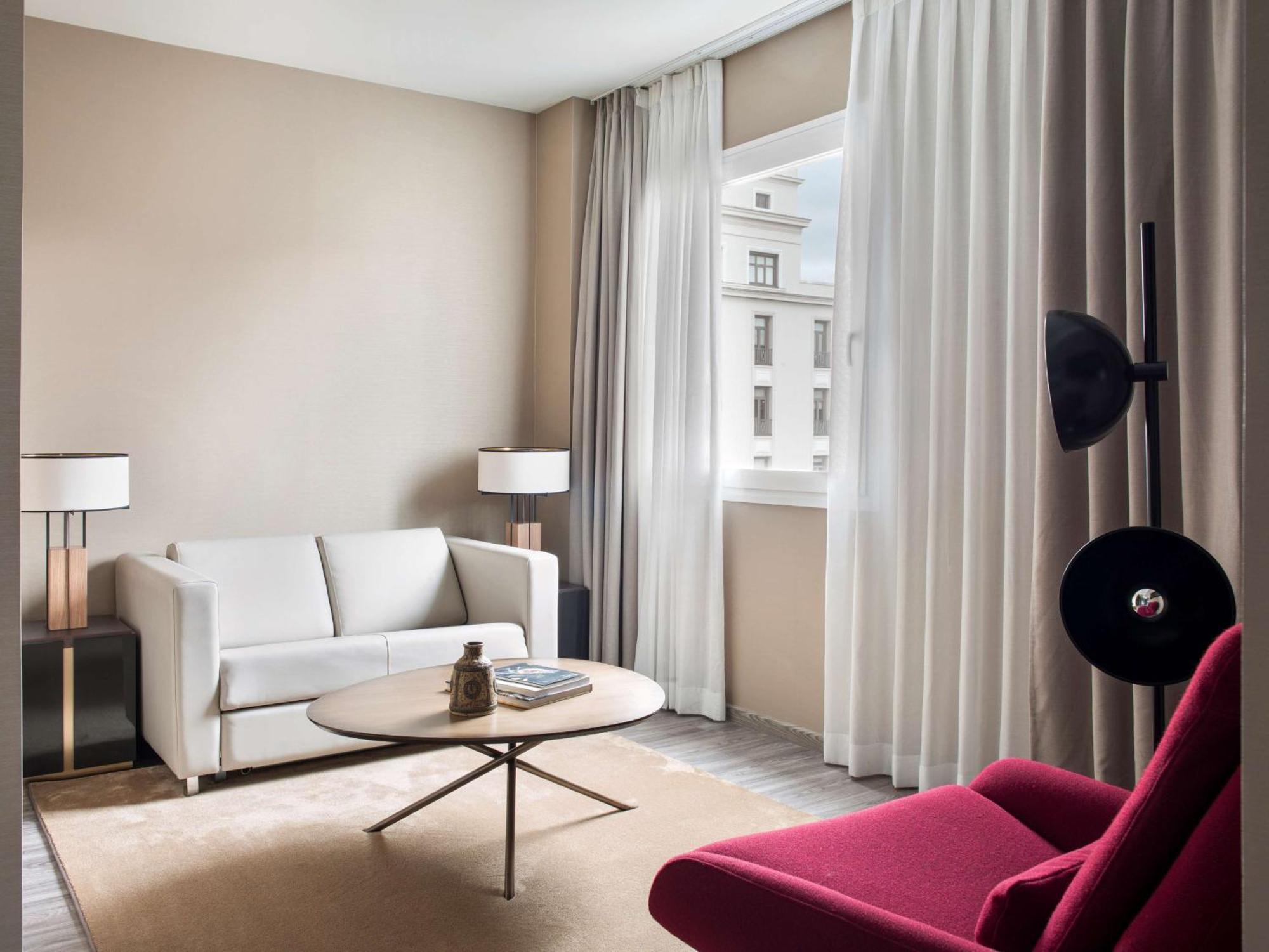 Nh Collection Madrid Suecia Hotel Bagian luar foto A living room at the hotel